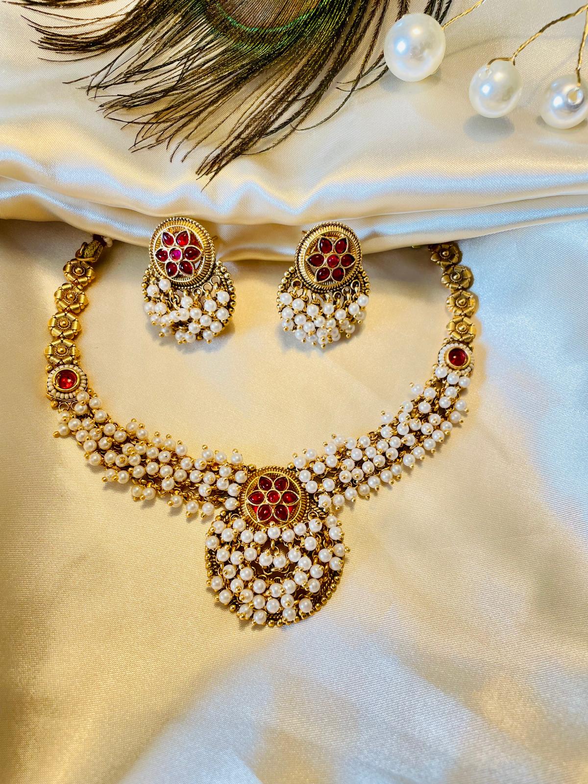 Traditional Ruby Pearl Necklace Set with Floral Motifs